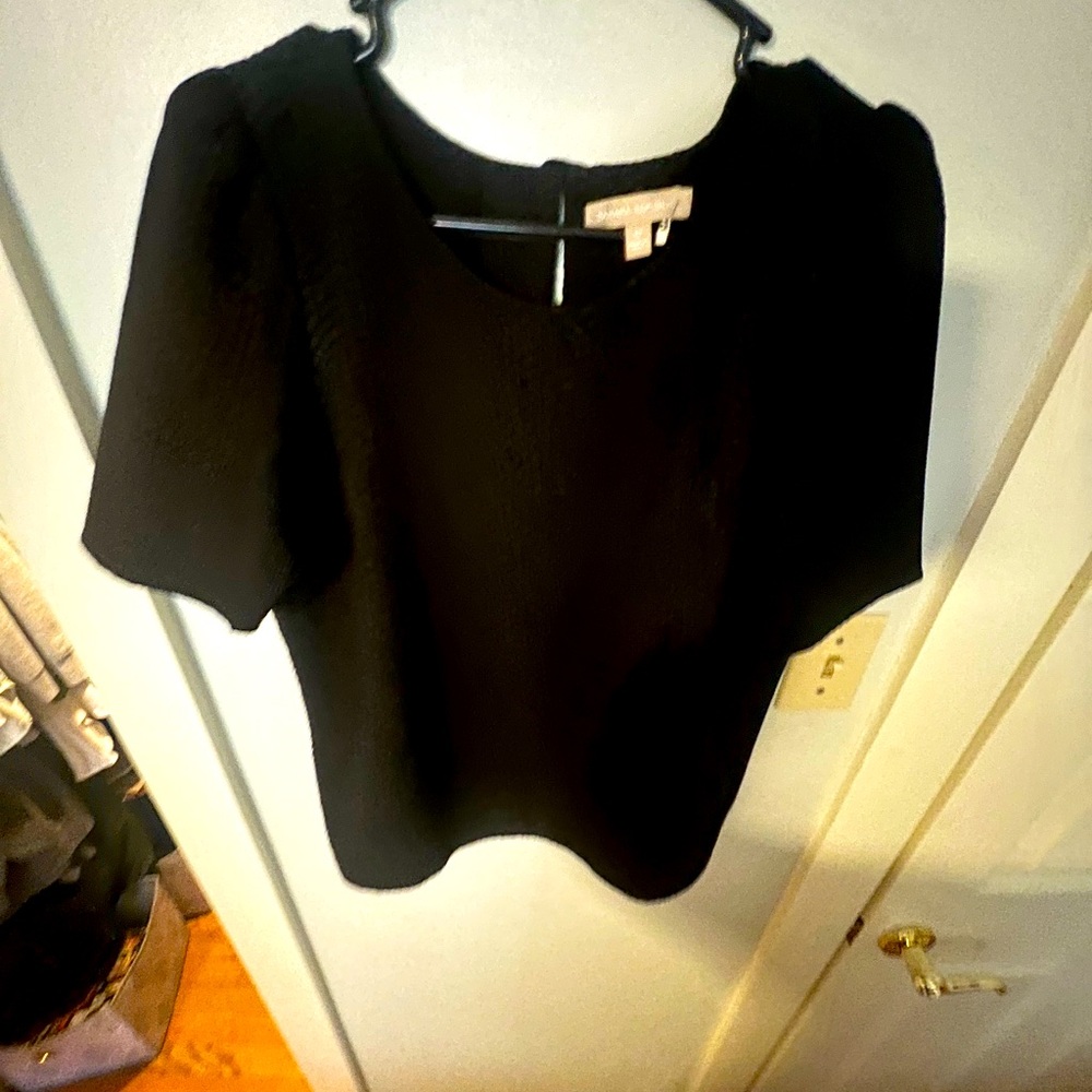 Black shell- short sleeved - slightly worn - recently dry cleaned